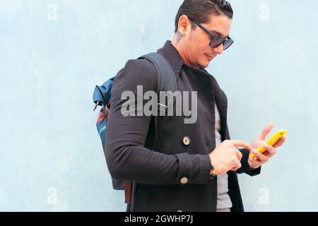 Handsome young man on the street using cell phone Stock Photo