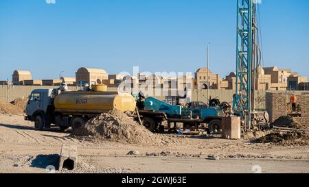 Water tanker truck at construction works near Karavan-Saray, a multifunctional tourist complex attraction, in historic city Turkistan, Kazakhstan Stock Photo