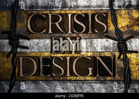Crisis By Design text on textured grunge copper and vintage gold background Stock Photo