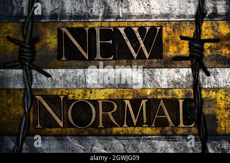 New Normal text on vintage textured grunge copper gold and silver background Stock Photo