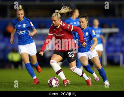 Manchester United's Alessia Russo (centre) and Birmingham City's Harriet Scott battle for the ball during the FA Women's Super League match at St. Andrew's, Birmingham. Picture date: Sunday October 3, 2021. Stock Photo