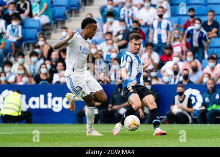 SPAIN, SOCCER, LA LIGA SANTANDER, RCDE VS REAL MADRID CF.  RCD Espanyol player (03) Adrià Pedrosa vies with (03) Éder Gabriel Militão during La Liga Santander match between RCD Espanyol and Real Madrid CF in RCDE Stadium, Cornellà, Spain, on October 3, 2021.  © Joan Gosa 2021. Credit: Joan Gosa Badia/Alamy Live News Stock Photo