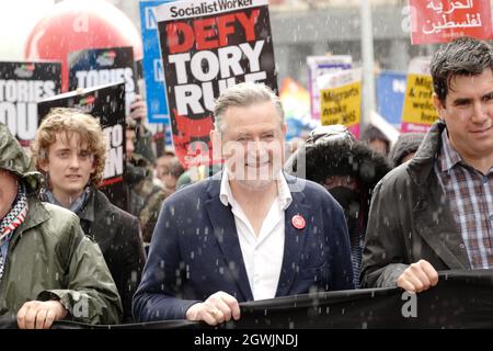 Manchester, UK. 3rd October, 2021. Labour MP Barry Gardiner joins Anti government Protests at Manchester UK. Protesters marched from The Manchester Royal infirmary along Oxford rd to the city centre  where many of the delegates are staying. Thousands of Tory delegates have converged at the Manchester Central convention complex and surrounding venues this weekend. The conference 3 to 6 October has triggered a number of demonstrations linked  to ending of Furlough, Universal credit cuts, Brexit , climate change and the restrictions imposed on demonstrations. Credit: GARY ROBERTS/Alamy Live News Stock Photo