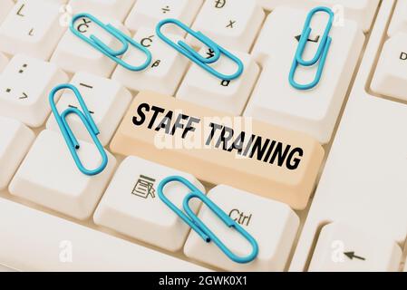 Conceptual caption Staff Training. Business showcase A program that helps employees to learn specific knowledge Abstract Doing Virtual Bookkeeping Stock Photo