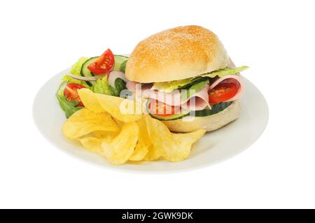 Ham and salad roll on a plate with salad and potato crisps isolated against white Stock Photo