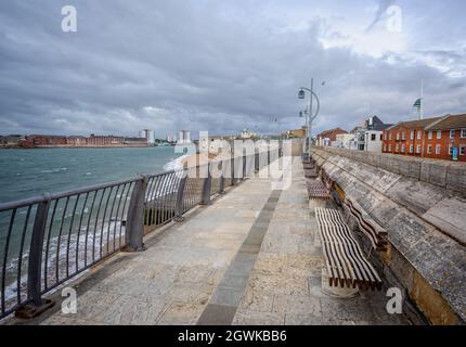 View along the walk way on top of the ancient harbour defence wall, Hotwalls, in Old Portsmouth, Hampshire, UK on 30 September 2021 Stock Photo