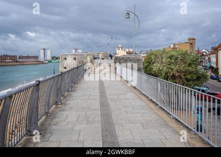 View along the walk way on top of the ancient harbour defence wall, Hotwalls, in Old Portsmouth, Hampshire, UK on 30 September 2021 Stock Photo