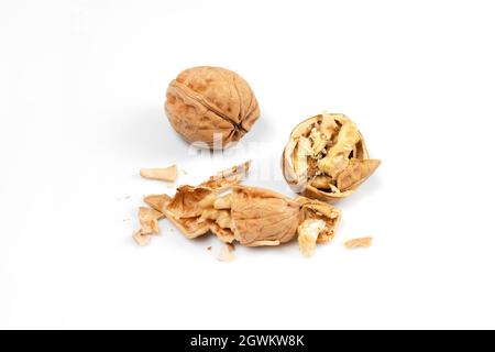 walnuts, whole walnuts on white background, cracked walnuts Stock Photo