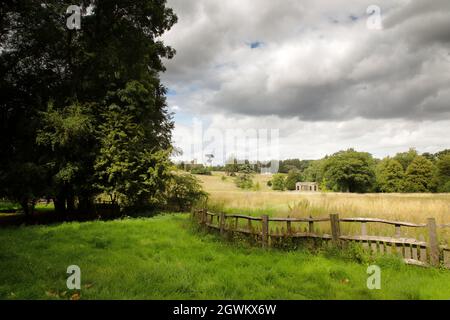 landscape image of stowe gardens with the Palladian Bridge, Cobham Monument and the Gothic Temple in the background Stock Photo