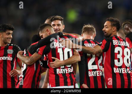 03 October 2021, North Rhine-Westphalia, Bielefeld: Football: Bundesliga, Arminia Bielefeld - Bayer Leverkusen, Matchday 7 at the SchücoArena. Leverkusen's goal scorer Kerem Demirbay (2nd from left) celebrates his goal for 0:4 with Nadiem Amiri, Lucas Alario, Daley Sinkgraven and Karim Bellarabi. Photo: Friso Gentsch/dpa - IMPORTANT NOTE: In accordance with the regulations of the DFL Deutsche Fußball Liga and/or the DFB Deutscher Fußball-Bund, it is prohibited to use or have used photographs taken in the stadium and/or of the match in the form of sequence pictures and/or video-like photo serie Stock Photo