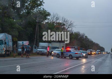 Anapa, Russia - 08.16.2019: traffic police blocked a section of the highway, traffic in the evening is difficult Stock Photo