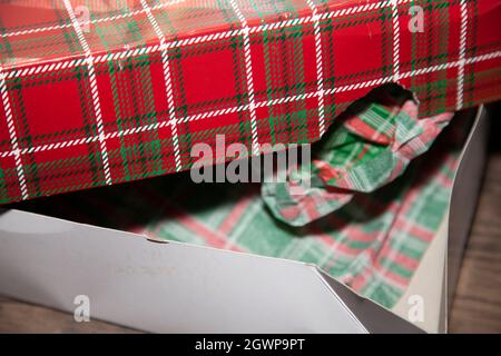 Open red, green, and white striped gift box Stock Photo