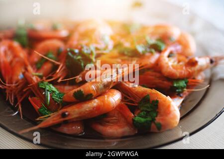 Delicious Prawns With Coriander In A Plate On The Table. Fresh Seafood Dish Close-up.