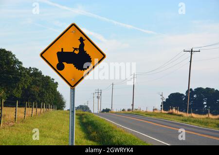 A tractor warning sign by the NC State University dairy farm near Raleigh. Stock Photo