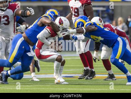 Los Angeles Rams defensive tackle Poona Ford, right, sacks Carolina ...