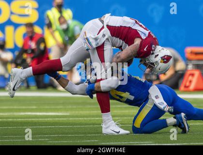 Los Angeles Rams safety Taylor Rapp (24) and Atlanta Falcons place