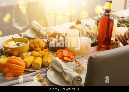 Beautiful table setting with different food for Thanksgiving Day celebration in dining room Stock Photo