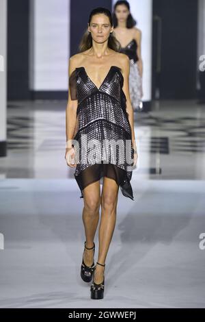 Carmen Kass walks the runway during the Valentino Haute Couture