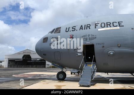 A C-17 Globemaster III aircraft from the 172nd Airlift Wing sits on the flight line at Muniz Air National Guard Base, Carolina, Puerto Rico, June 21, 2021. Airmen from the 172nd Maintenance Group, 183rd Aeromedical Evacuation Squadron, 172nd Communications Flight and the 172nd Airlift Wing staff traveled from Flowood, Mississippi, to Puerto Rico to complete training. Mississippi Air National Guard Airmen representing various Air Force specialty codes had the opportunity to collaborate with peers in the Puerto Rico Air National Guard during the training schedule. (U.S. Air National Guard photo Stock Photo