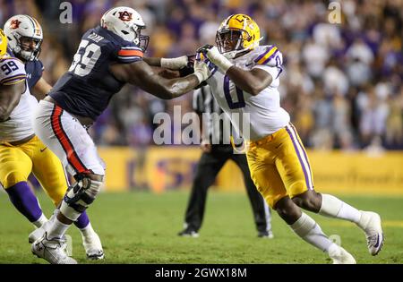 Baton Rouge, LA, USA. 2nd Oct, 2021. LSU defensive lineman Maason Smith (0) tries to get around Auburn's Brodarious Hamm (56) during NCAA football game action between the Auburn Tigers and the LSU Tigers at Tiger Stadium in Baton Rouge, LA. Jonathan Mailhes/CSM/Alamy Live News Stock Photo