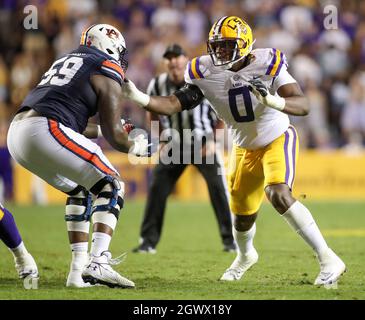 Baton Rouge, LA, USA. 2nd Oct, 2021. LSU defensive lineman Maason Smith (0) tries to get around Auburn's Brodarious Hamm (56) during NCAA football game action between the Auburn Tigers and the LSU Tigers at Tiger Stadium in Baton Rouge, LA. Jonathan Mailhes/CSM/Alamy Live News Stock Photo