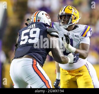 Baton Rouge, LA, USA. 2nd Oct, 2021. LSU defensive lineman Maason Smith (0) tries to get around Auburn's Brodarious Hamm (56) during NCAA football game action between the Auburn Tigers and the LSU Tigers at Tiger Stadium in Baton Rouge, LA. Jonathan Mailhes/CSM/Alamy Live News Stock Photo