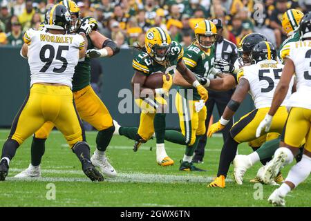 Green Bay, Wisconsin, USA. 03rd Oct, 2021. Green Bay Packers running back  Aaron Jones (33) rushing the ball during the NFL football game between the  Pittsburgh Steelers and the Green Bay Packers