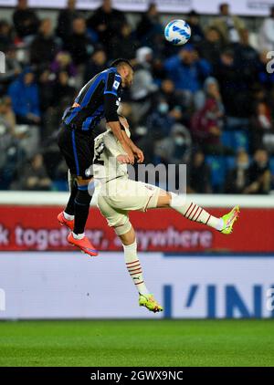 Bergamo, Italy. 3rd Oct, 2021. AC Milan's Ante Rebic (R) vies with Atalanta's Jose Palomino during a Serie A football match between Atalanta and AC Milan in Bergamo, Italy, Oct. 3, 2021. Credit: Str/Xinhua/Alamy Live News Stock Photo