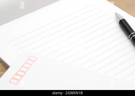 Japanese writing letter paper with ballpoint pen on wooden background Stock Photo