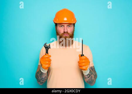 Incompetent worker is unsure and confused about his work Stock Photo
