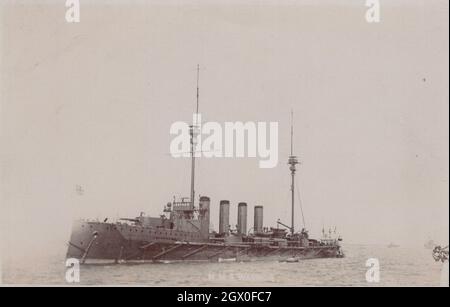 extra super rare antique monochrome photograph from the 1900s. One of the gem of the British Empire's Royal Navy warship, battleship is visible of this photo.  . This ship  Swiftsure-class pre-dreadnought battleships of the Royal Navy. This HMS warship is showing power very much. Location: sea. Period: 1900s. Source: original photocard. Stock Photo