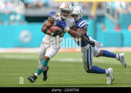 August 19, 2023: Miami Dolphins running back Salvon Ahmed (26) carries the  ball as Houston Texans safety Jimmie Ward (1) looks on after missing a  tackle during an NFL preseason game between