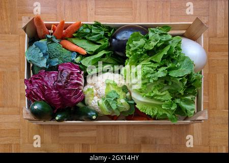 Directly above shot of healthy vegetables in wooden container Stock Photo