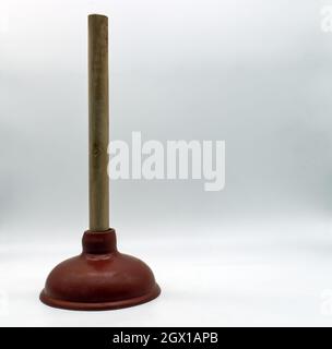 Rubber Plunger with wooden grip isolated on white background Stock Photo