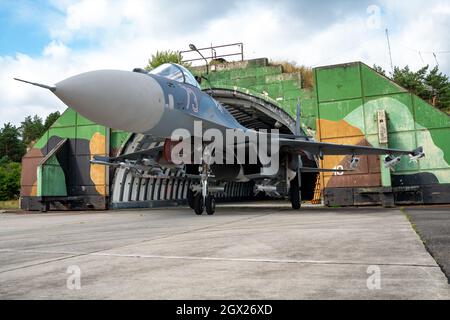 Fighter plane from the SU-27 family with suspended armaments Stock Photo