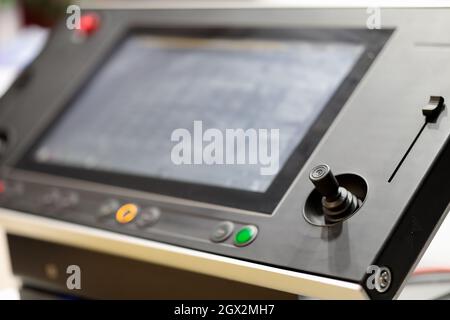 Industrial control console with touch screen and joystick. Selective focus. Stock Photo