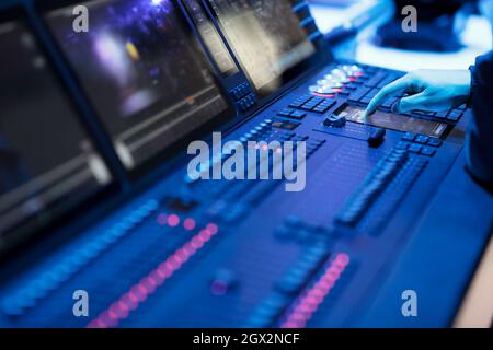 Operator working with stage lighting control panel. Selective focus. Stock Photo