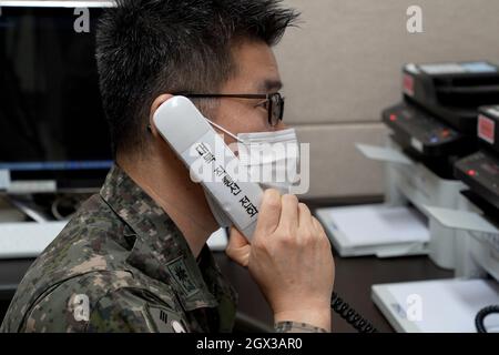 Seoul, South Korea. 4th Oct, 2021. Oct 4, 2021-Seoul, South Korea-This photo, provided by the defense ministry, shows a South Korean officer making a test call with North Korea via a hotline set up between the militaries of the two Koreas on Oct. 4, 2021. The Koreas restored their direct communication lines on the same day after 55 days of suspension. (Credit Image: © Defese Ministry via ZUMA Press Wire) Stock Photo