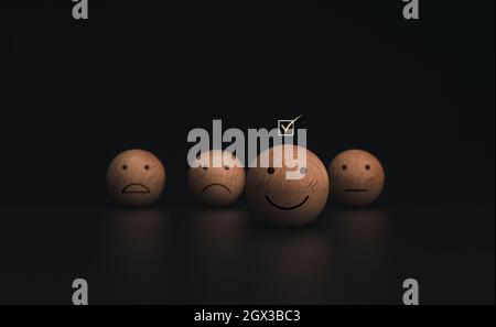 Check mark a checkbox on smiley emoticon face on the wooden balls on ...