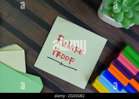 Future Proof write on sticky notes isolated on Wooden Table. Stock Photo