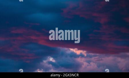 Purple and blue clouds at twilght or dusk. Dramatic clouds background. Cloudscape background photo. Stock Photo