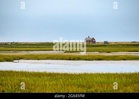 View to Blakeney Watch House over river Glaven and the marshes in Blakeney Natural Nature Reserve, Norfolk, England. Stock Photo