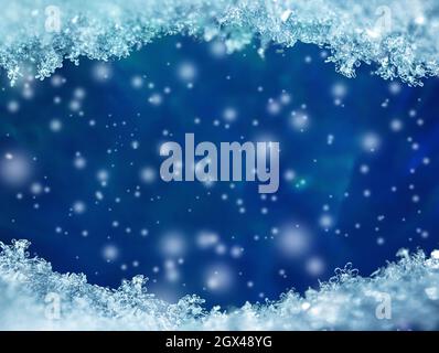 Natural snow texture with snowflakes close-up with falling snow on a blue background and free copy space for text. Christmas card. Macro texture of sn Stock Photo