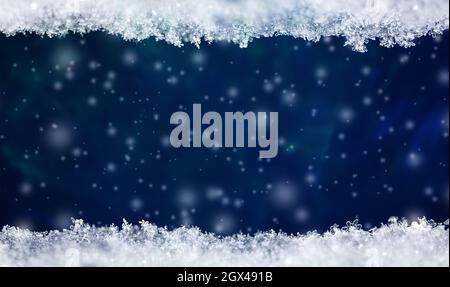 Natural snow texture with snowflakes close-up with falling snow on a blue background and free copy space for text. Christmas card template . Macro tex Stock Photo