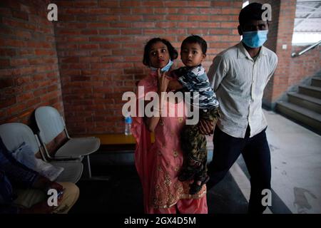 Kathmandu, Nepal. 4th Oct, 2021. Family members of a two-year-old boy (name undisclosed) walk towards the Ocularist to implant custom made prosthesis after his left eye was removed in a surgery affected by retina cancer at Tilganga Eye hospital in Kathmandu, Nepal on Monday, October 4, 2021. (Credit Image: © Skanda Gautam/ZUMA Press Wire) Stock Photo
