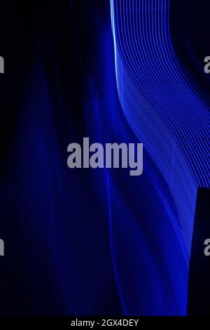 Wavy neon blue abstract light trail pattern Stock Photo