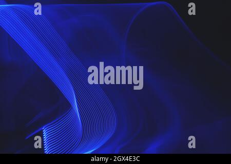 Neon blue abstract breaking wave light trail pattern Stock Photo