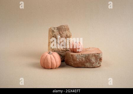 Halloween background podium display with pumpkins on biege background. Cosmetic, beauty product promotion autumn pedestal Stock Photo