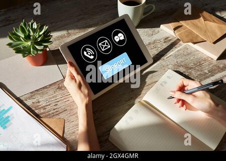 Technical support icons on screen. Call to help center. Internet and technology concept. Stock Photo