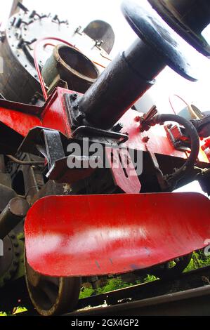 Old steam locomotive. Vintage coal train. Rusty retro iron machine. Stock Photo